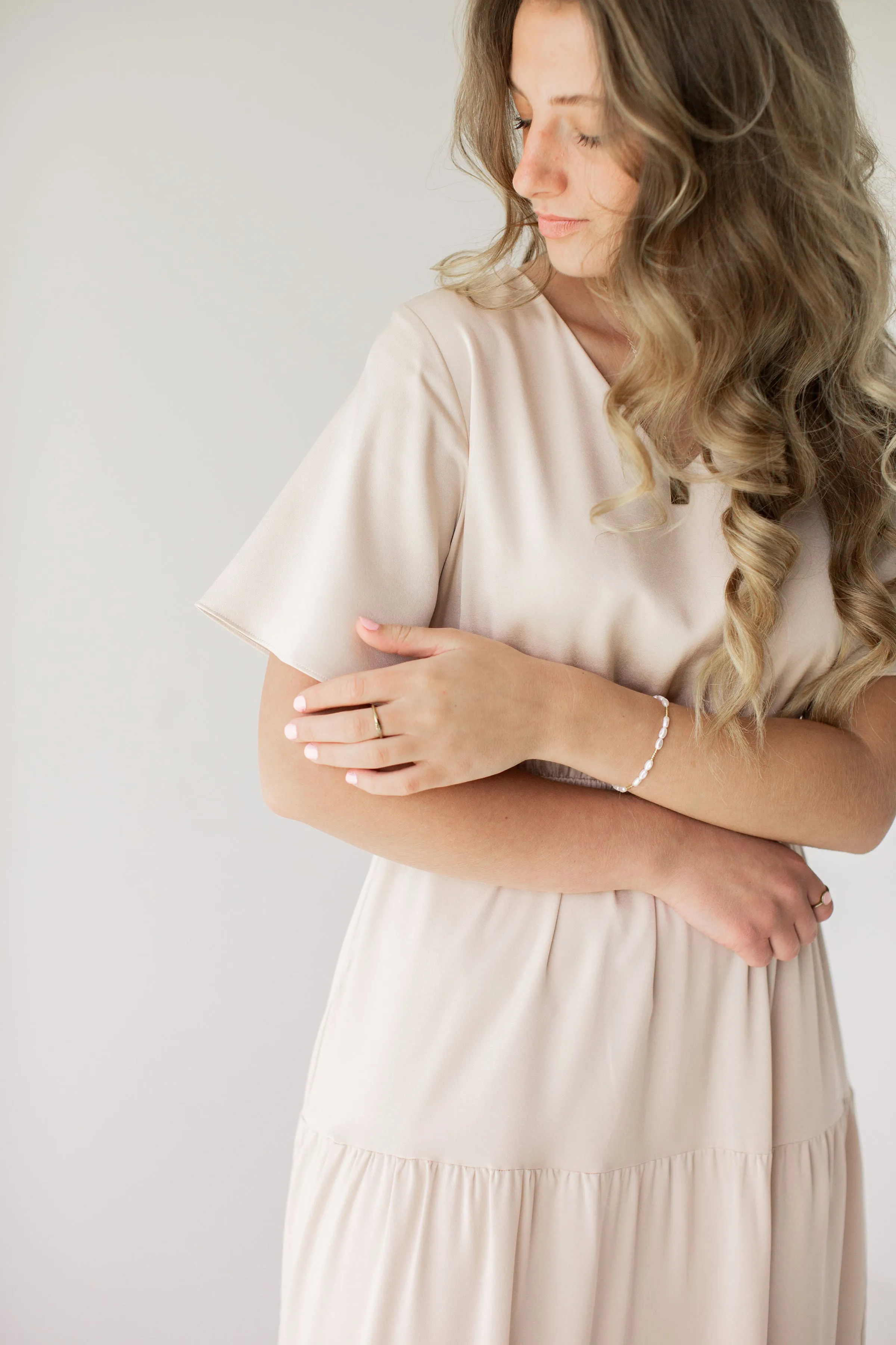 'Aria' Muted Satin Flutter Sleeve Tiered Maxi Dress in Champagne